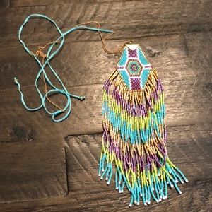 Necklace with Native American inspired design. Finest beaded work w/ silk string